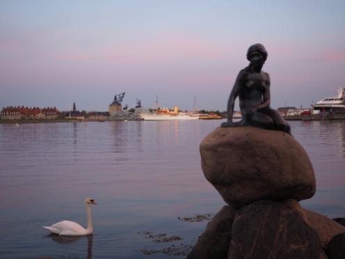 The Little Mermaid and her swan at sunset